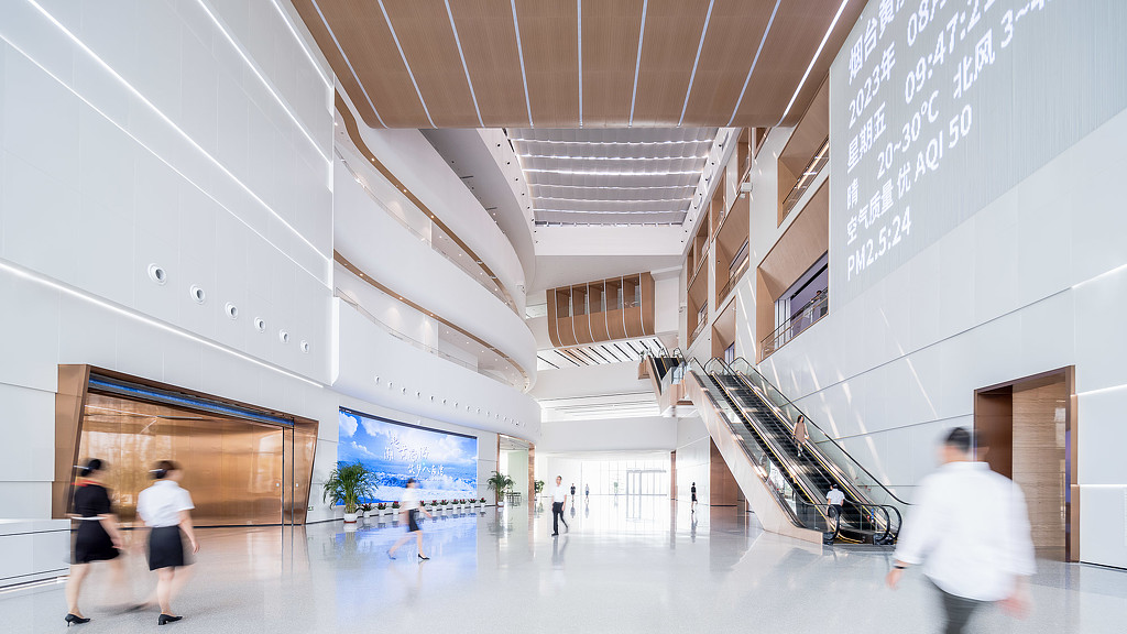 People walking inside a building lobby